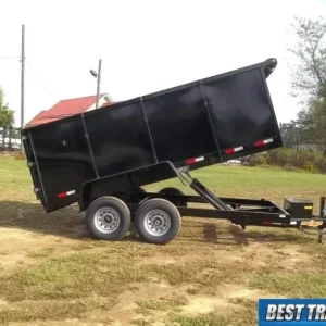 A dump trailer is parked on the side of a road.