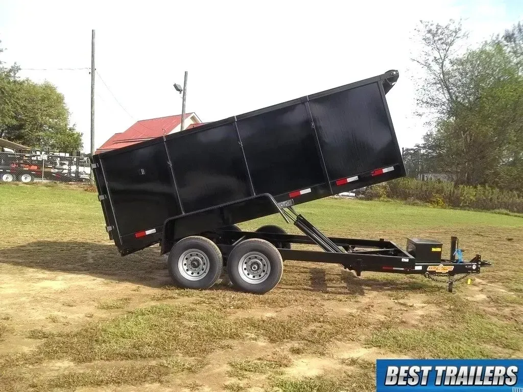 A dump trailer is parked on the side of a road.